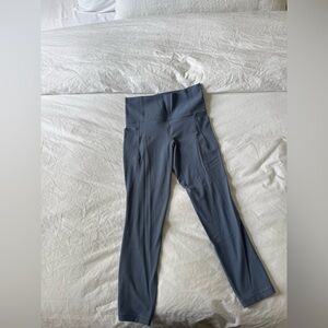 Athleta Salutation Stash 7/8 tights size small petite